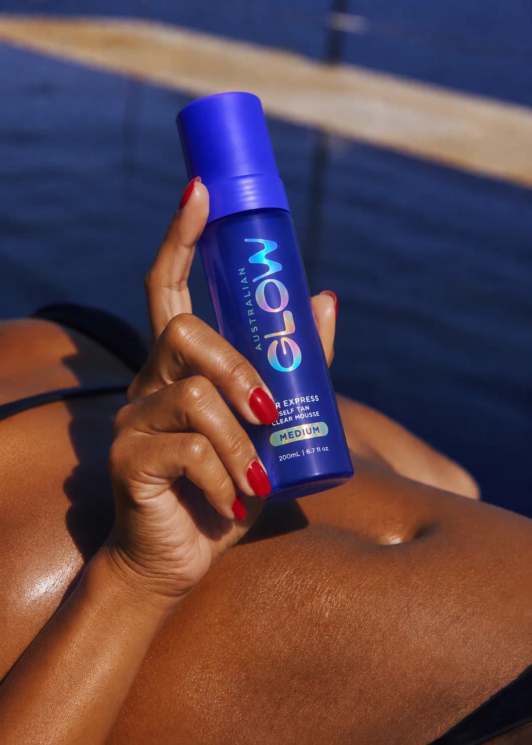 1 Hour Express Clear Mousse held poolside over sun-warmed skin