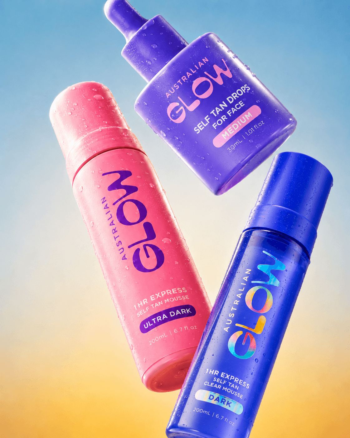 Australian Glow — three self-tan bottles suspended on a peach-blue sunset gradient