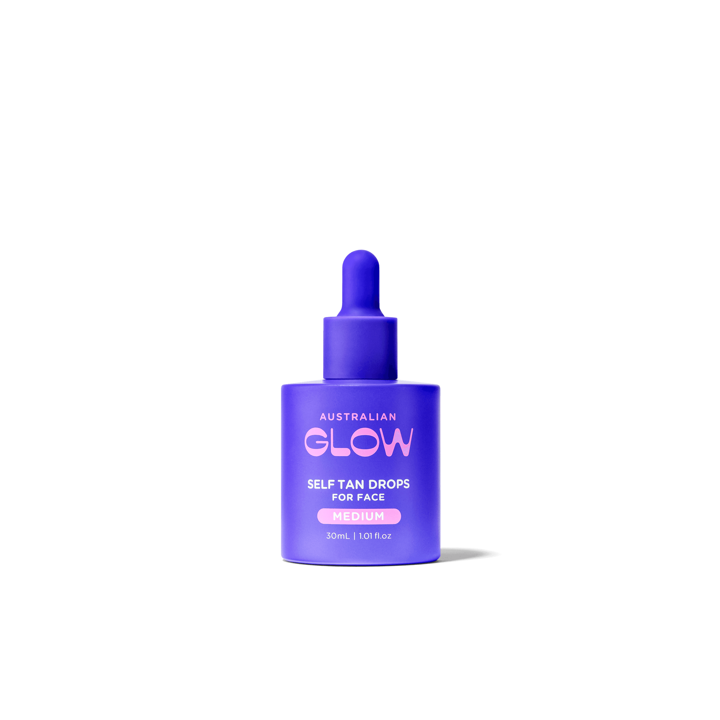Face Tan Drops — clear glass dropper bottle on warm sand backdrop