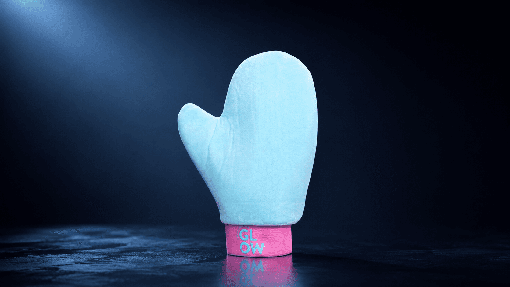 The Blend & Slay Mitt — editorial, lit on a dark plinth