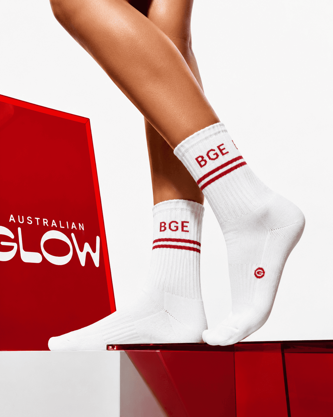 BGE Sock standing pose — full leg with red acrylic prism behind